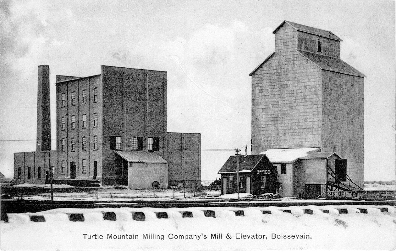 [Scanned photo of the Turtle Mountain Milling Co. flour mill and elevator]