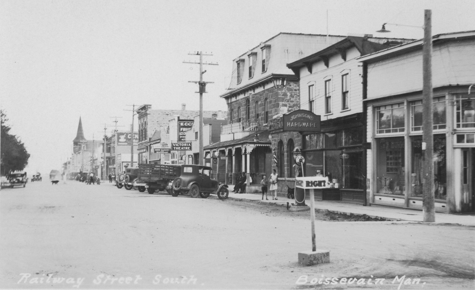 [Scanned photo of South Railway looking east from the Stephen Street intersection with angle parked early automobiles]