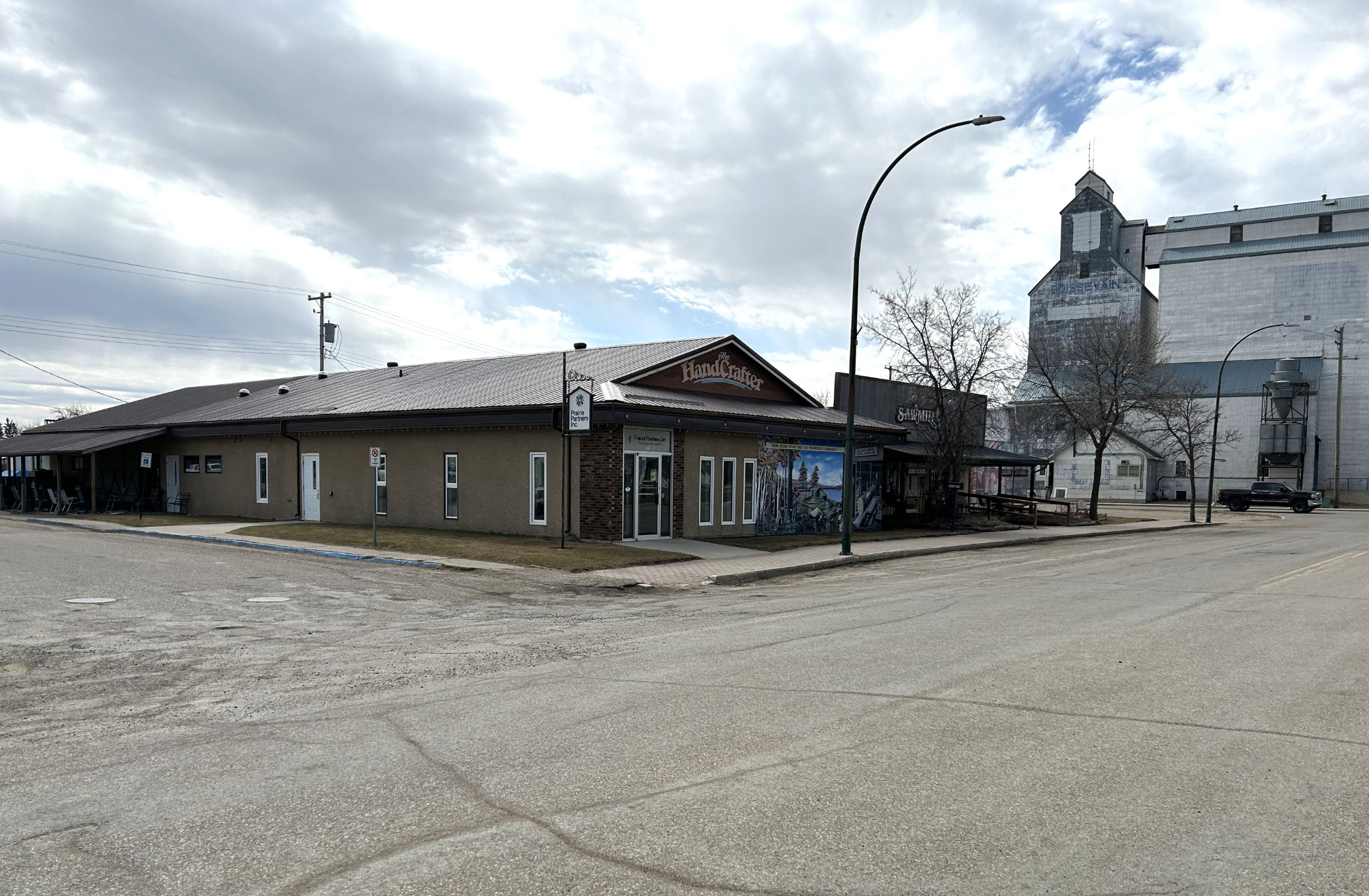 [2024 photo of the Prairie Partners properties (the HandCrafter and The Sawmill Tea and Coffee buildings)]