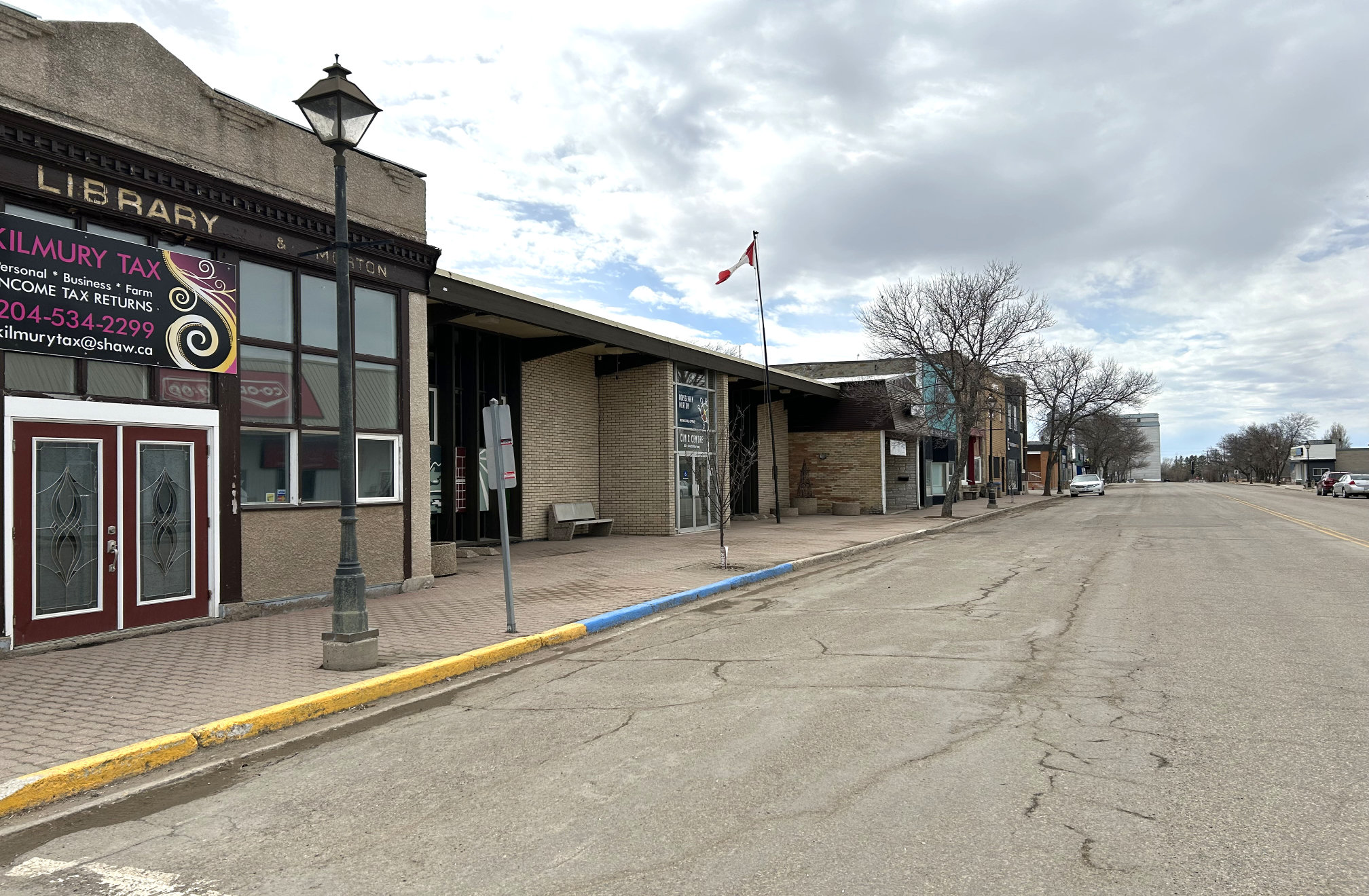 [2024 photo of South Railway looking west from the Kilmury Tax building (with old Library signage)]